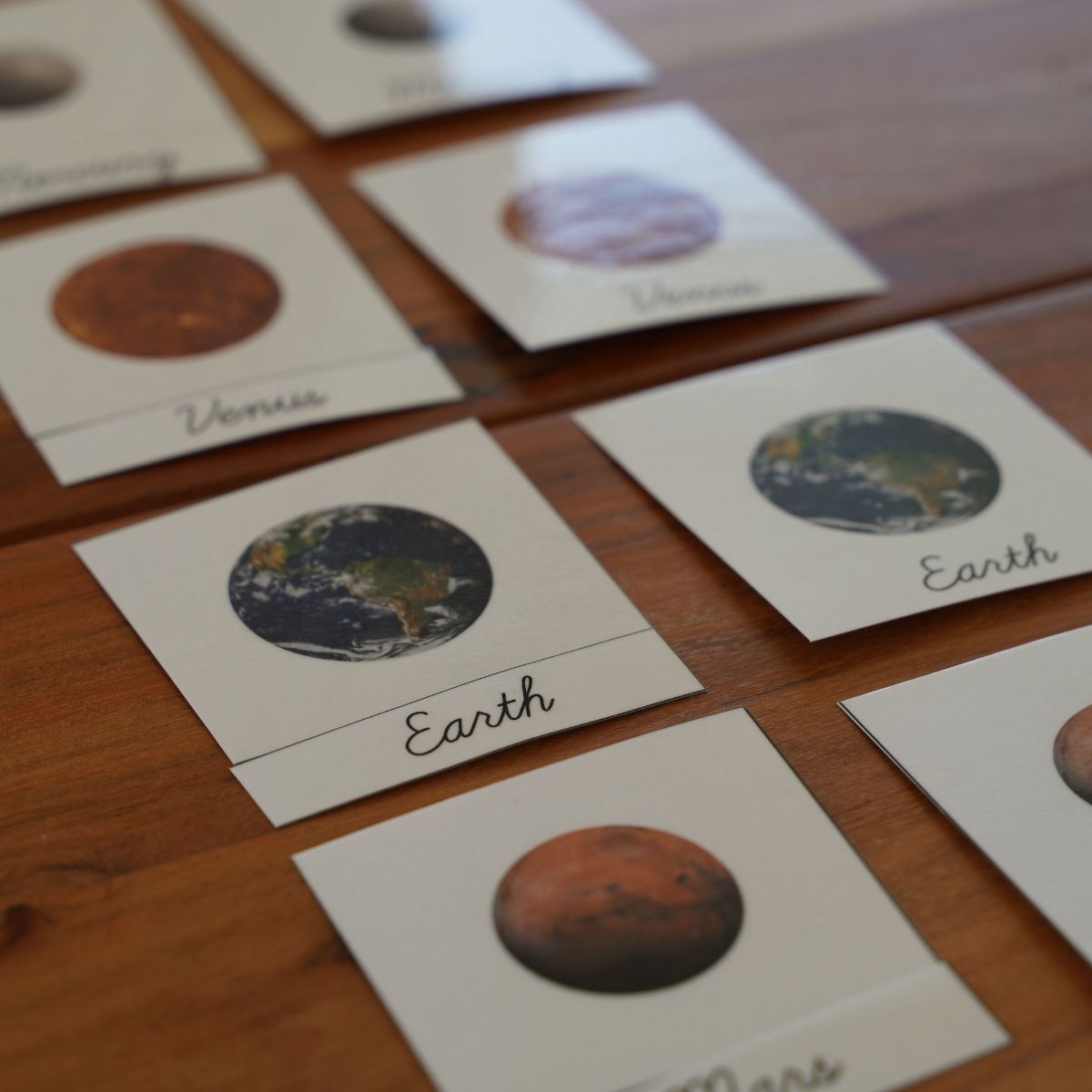 Montessori planet picture cards showing Venus, Earth and Mars.