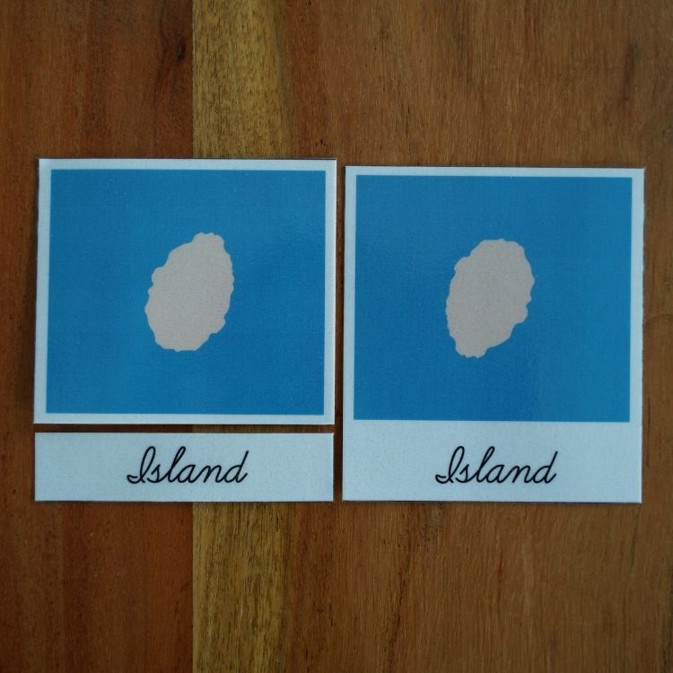 Montessori island three-part cards showing blue background with a land shape and matching label card for geography learning.